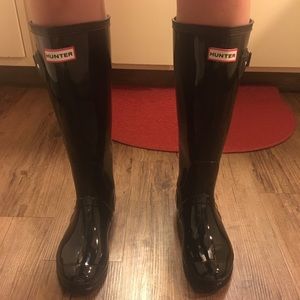 Black tall hunter boots